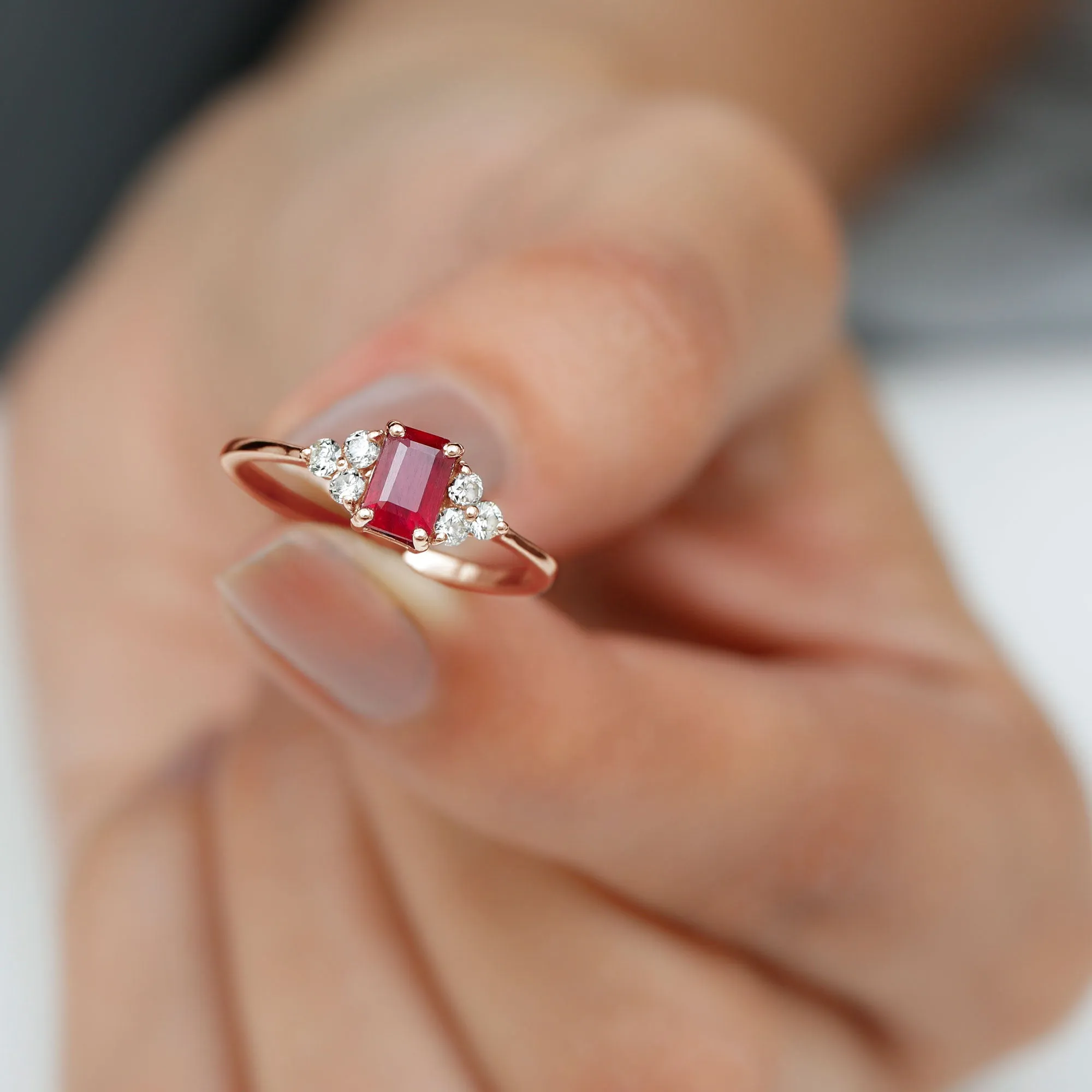 Emerald Cut Ruby Solitaire Ring with Diamond Trio