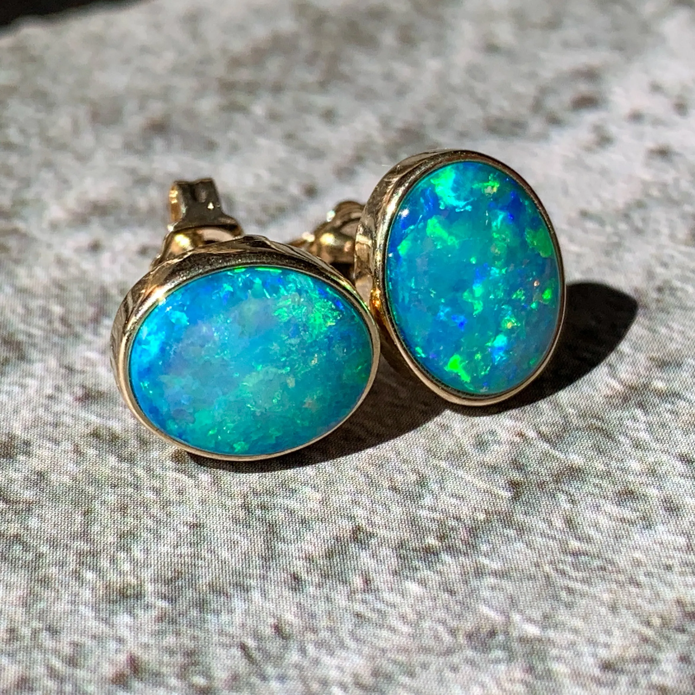 One pair of 9kt Green Blue Light Opal 2.05ct bezel set earrings