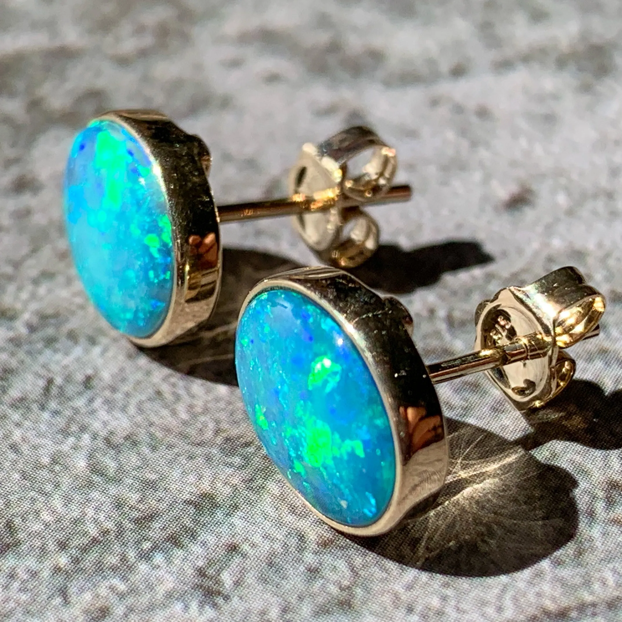 One pair of 9kt Green Blue Light Opal 2.05ct bezel set earrings